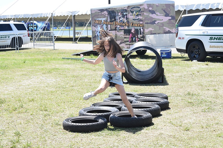 Lakewood Ranch's Brynn DeFoor, who is 10 years old, makes her way through the Sarasota County Sheriff's Office junior obstacle course.