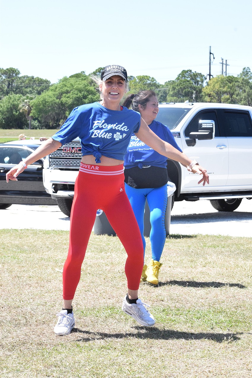 Lakewood Ranch's Darlene Phipps leads a group through a demonstration of Florida Blue at UTC's zumba class.
