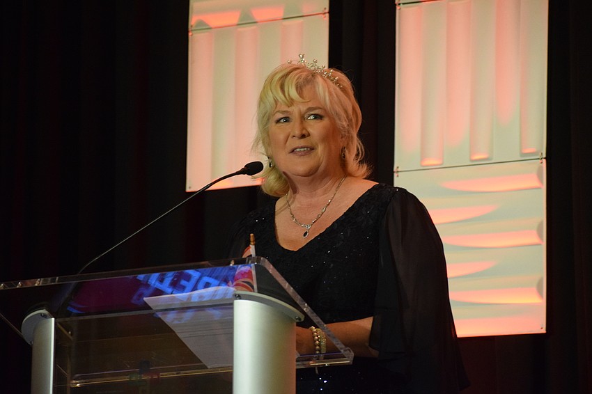 Maribeth Phillips, the president and CEO of Meals on Wheels Plus of Manatee, welcomes guests to Tropical Nights — A Royal Affair.