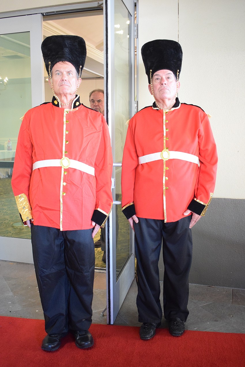 Stoneybrook's Mike Neville and Venice's Bill Lehnert guard the Grove ballroom as part of the Queen's Guard.