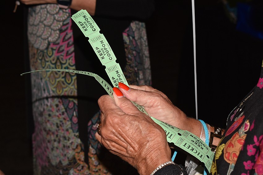 Linda Federici sells raffle tickets.