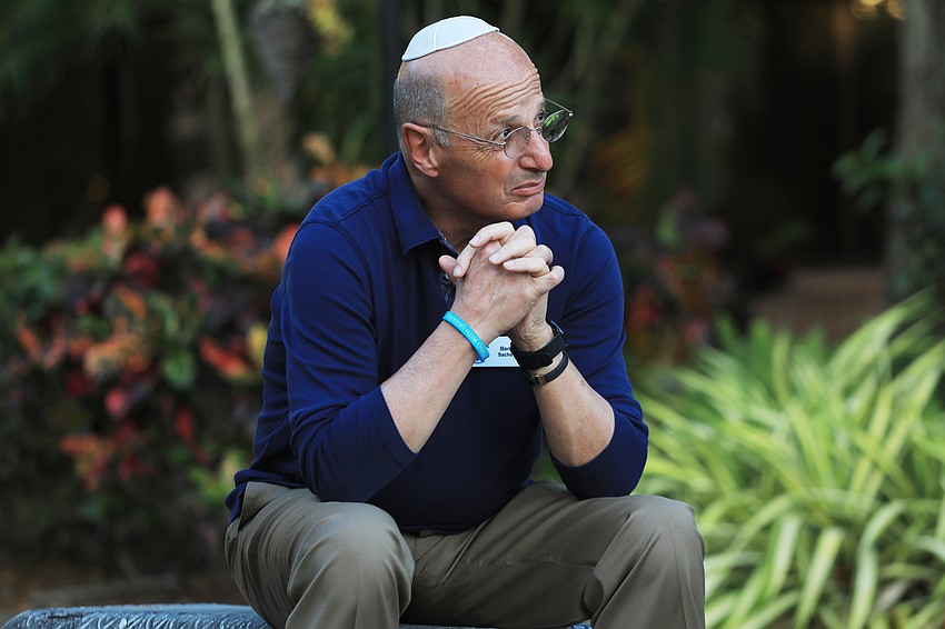 Dr. Ben Sachs listens to the speaker.