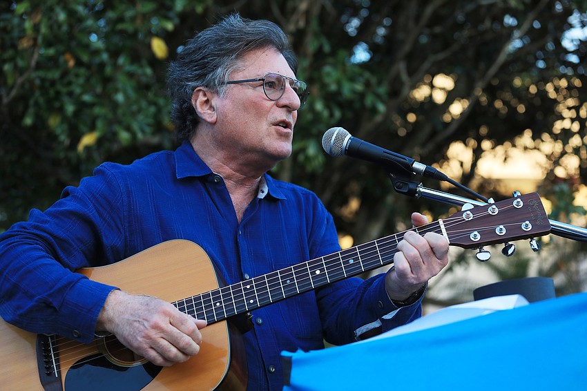 Temple Beth Shalom Rabbi Stuart Altshuler sings with the audience.