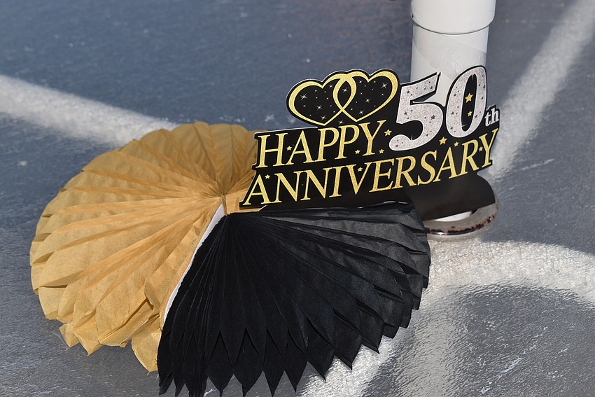 Golden anniversary decorations were spread out poolside.