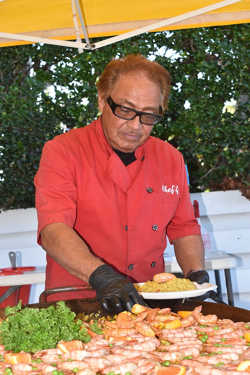 Chef Ef Martinez cooks up paella for the crowd.