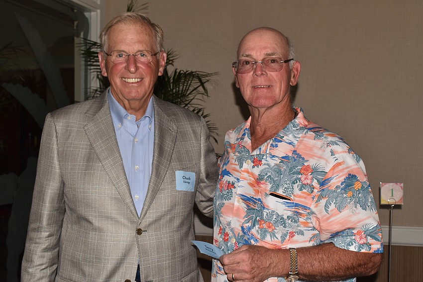 Chuck Eldridge and Terry McGovern greeted each other at the beginning of the party.