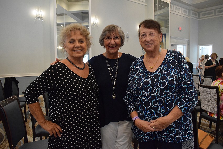 Cascades' Karen West, Elaine Alexis and Meryl Smith get together during the fashion show.