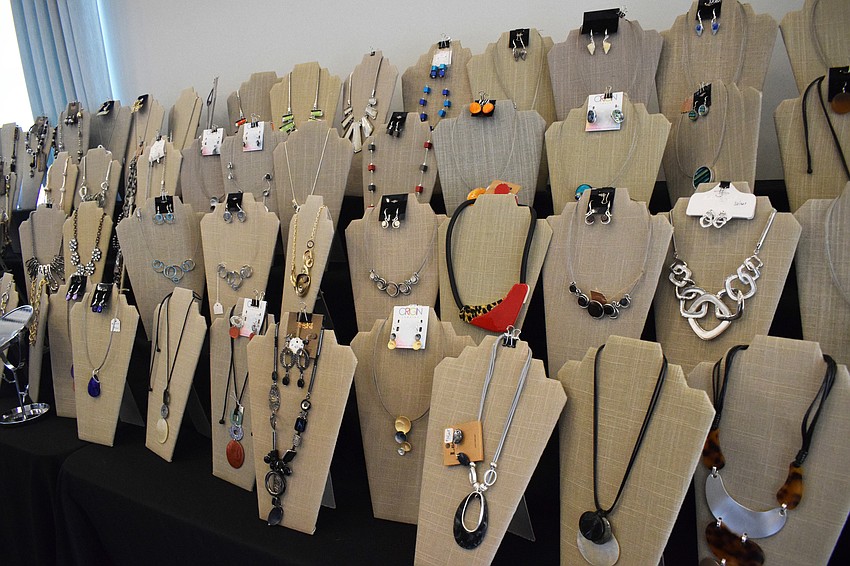Cascades of Sarasota Women's Club members view dozens of pieces of jewelry during the fashion show event.