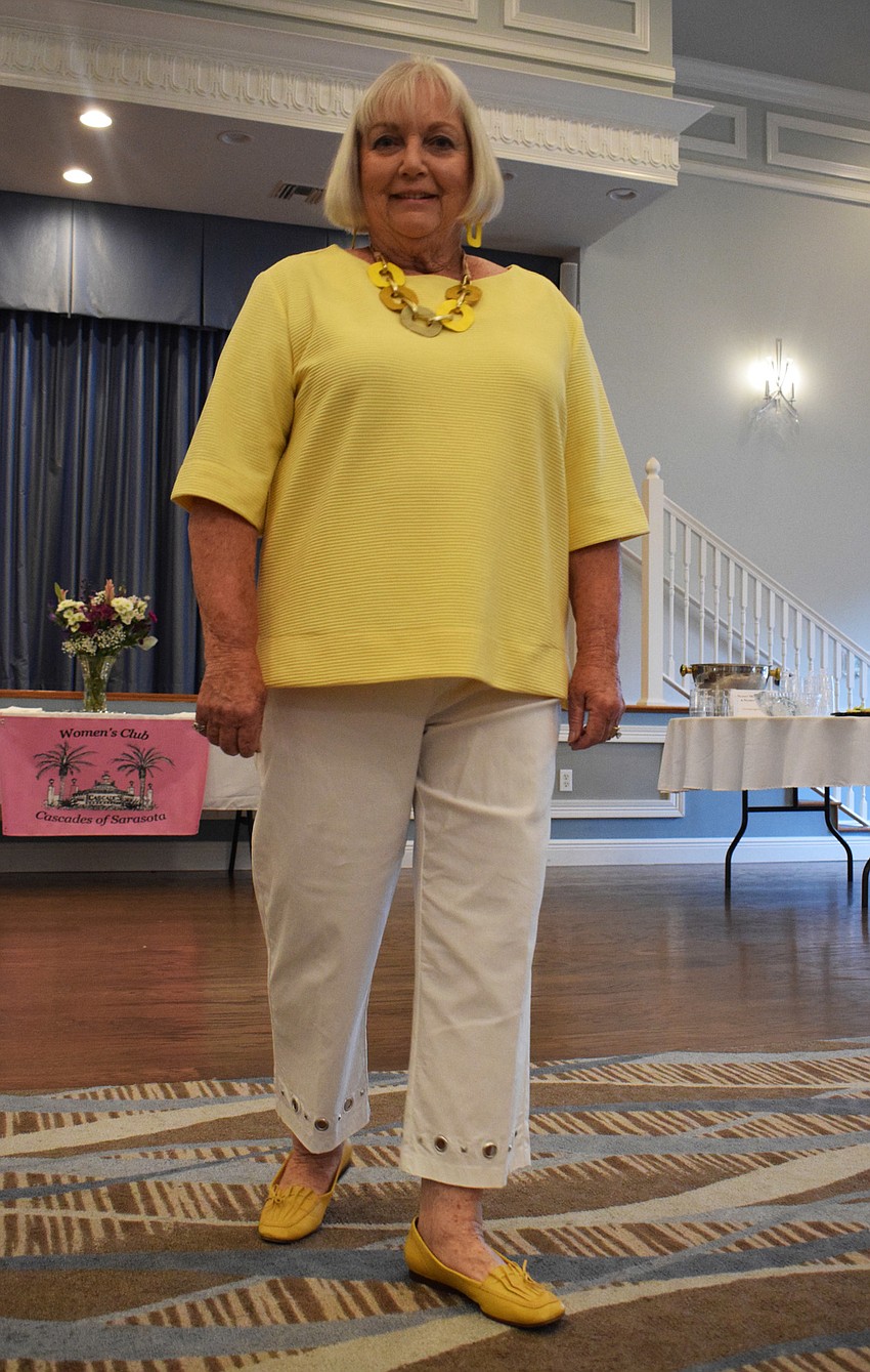 Cascades' Ruth Dweck pauses for a moment to give Cascades of Sarasota Women's Club members an opportunity to see her outfit up close.