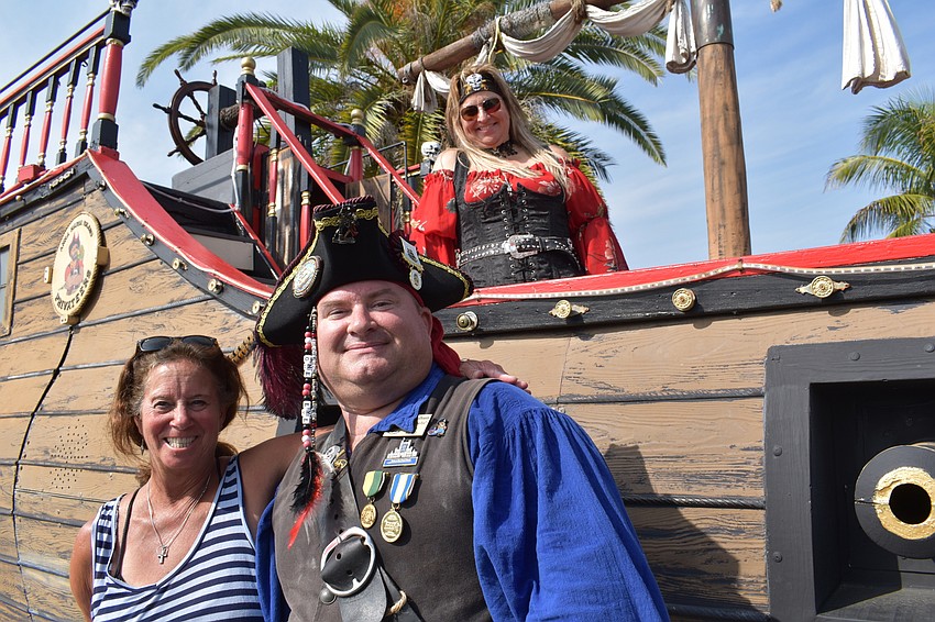 Karen MacKay prepares to board with Jamie VanDenson and Kim Boyd, already on board.