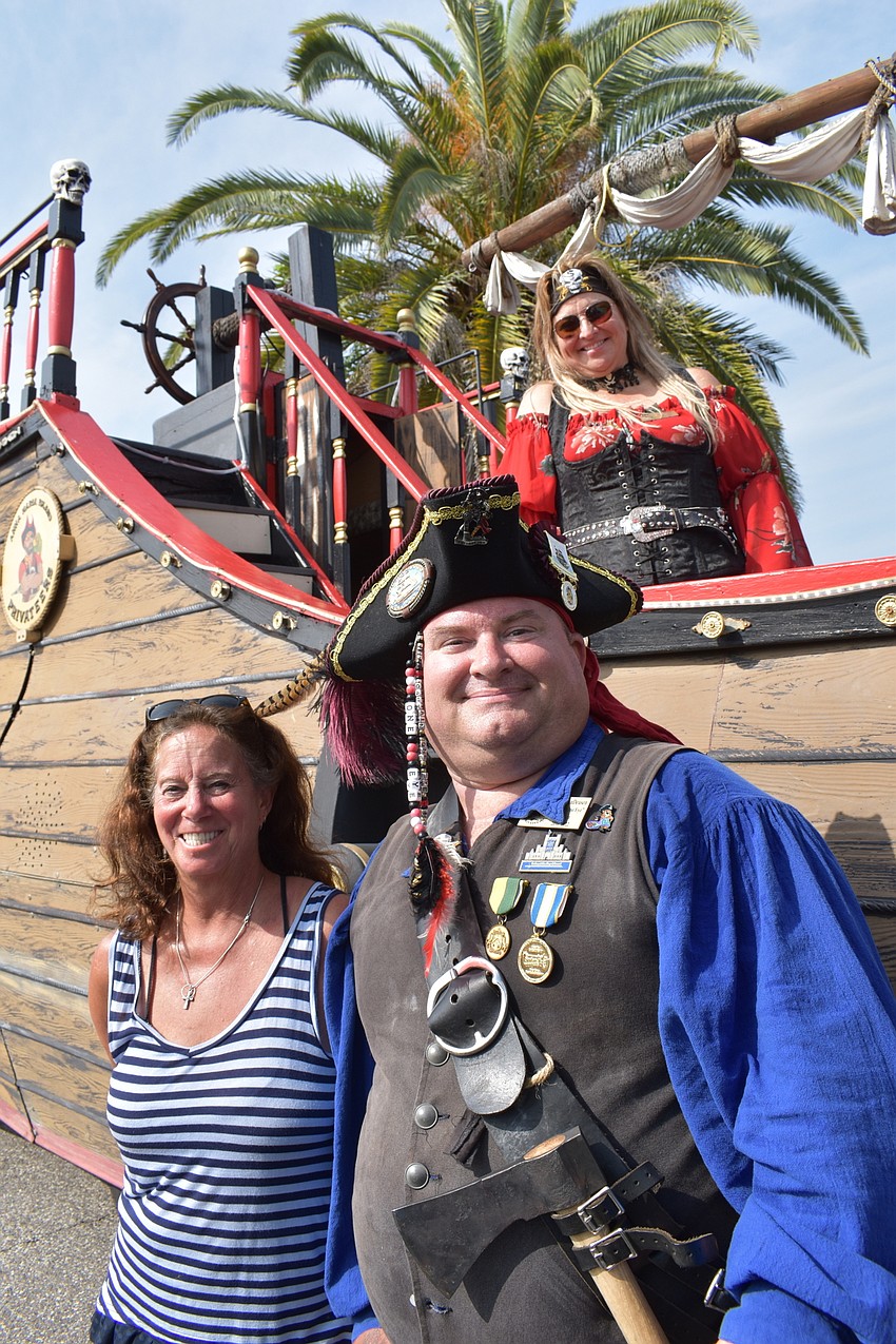 Karen MacKay prepares to board with Jamie VanDenson and Kim Boyd, already on board.