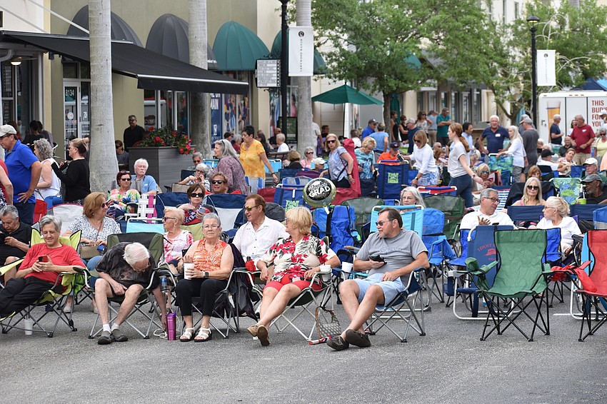 With the popular band Kettle of Fish playing, people arrived early to position their seats at Music on Main.