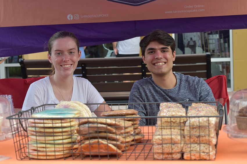 Emily Lynch and Michael DeNardo of Sarasota Cupcake offer items from their basket of goodies.