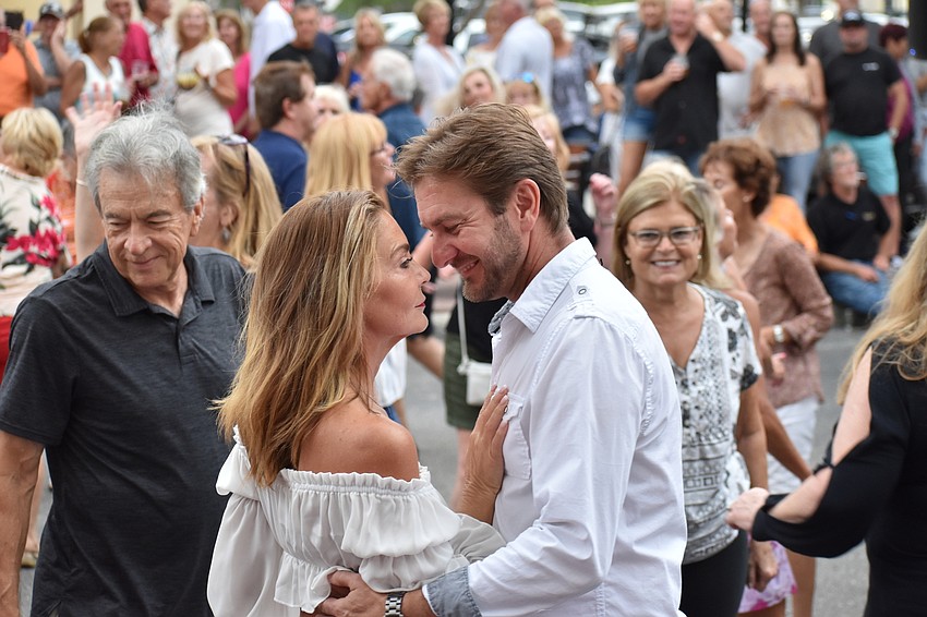 The Meadows' Carla Bright and Sarasota's Jim Barnacz enjoy a dance on a crowded Lakewood Main Street during Music on Main.