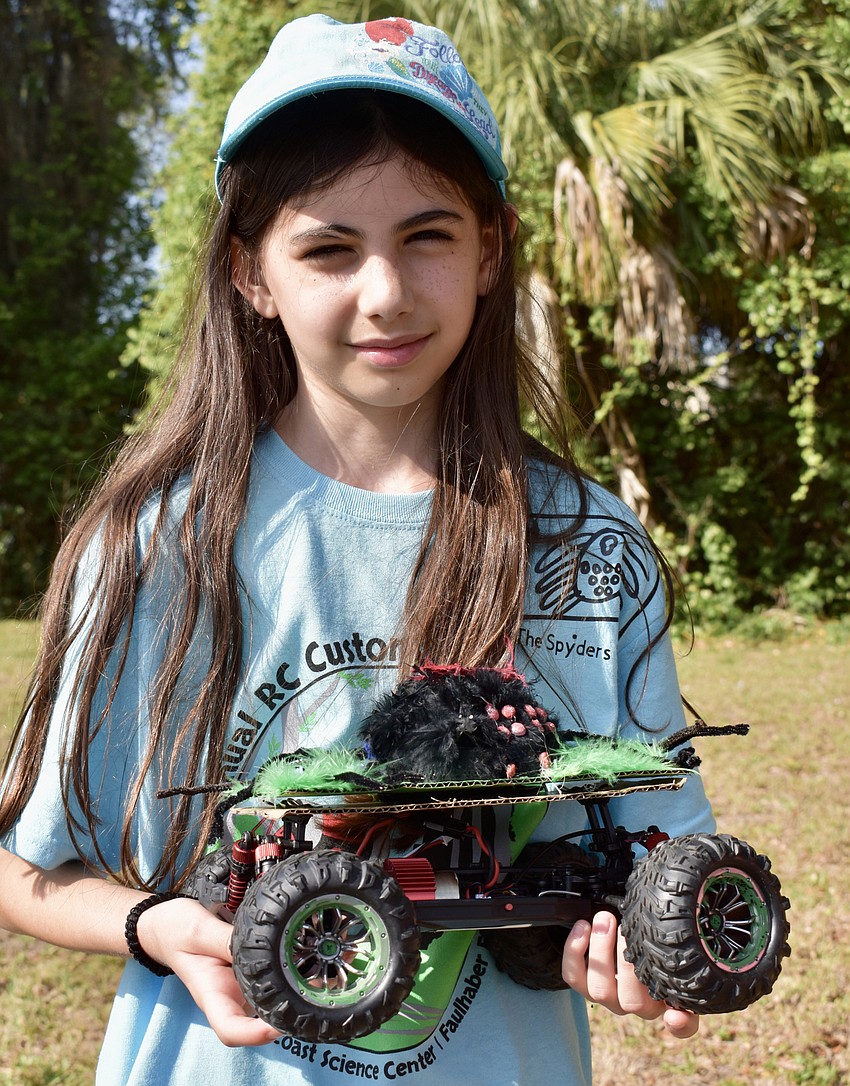Olivia Ramsdell, 10, a student at Wilkinson Elementary shows off her team's creation.