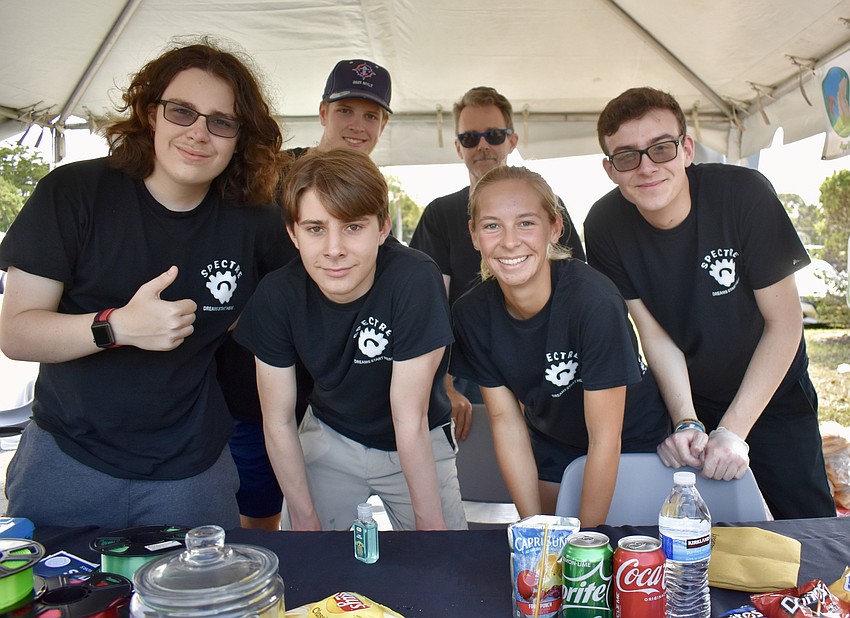 The Spectre Robotics Team  and Jungle Robotics team  teamed up to run the concessions. (back row) Roger Benson and Johnathan Vinson and (front row) Josh Bowen, Elliott Bang, Sophia Woodbury and Samuel Wright.