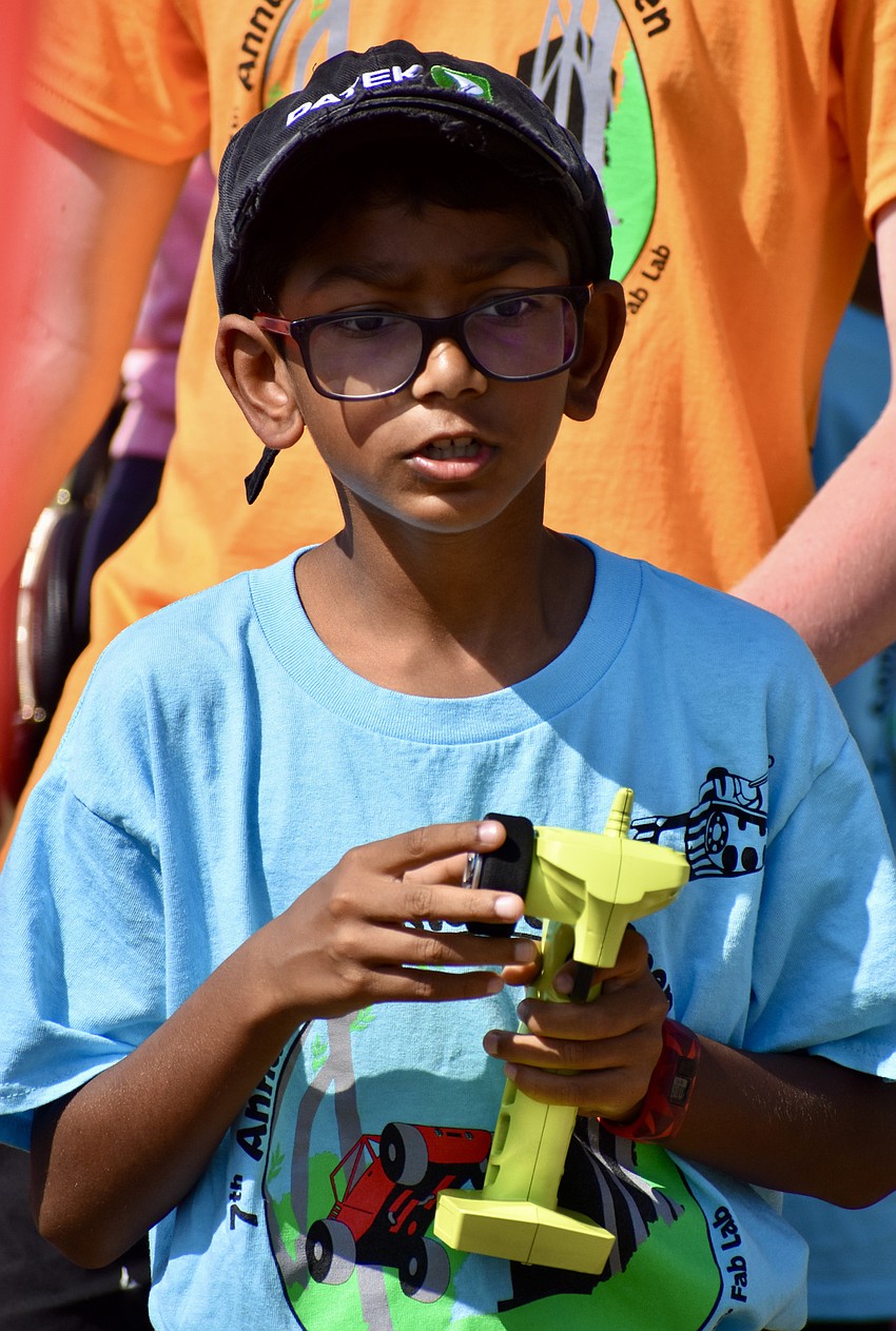 Shri Raj pilots his car through a preliminary race.