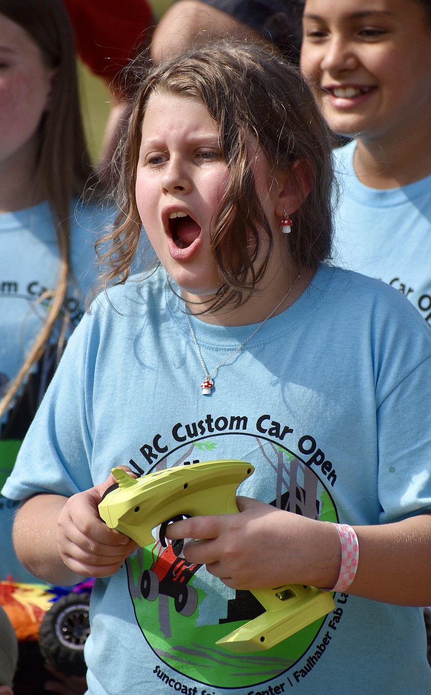 Tallulah Brand steers her car through the obstacle course.