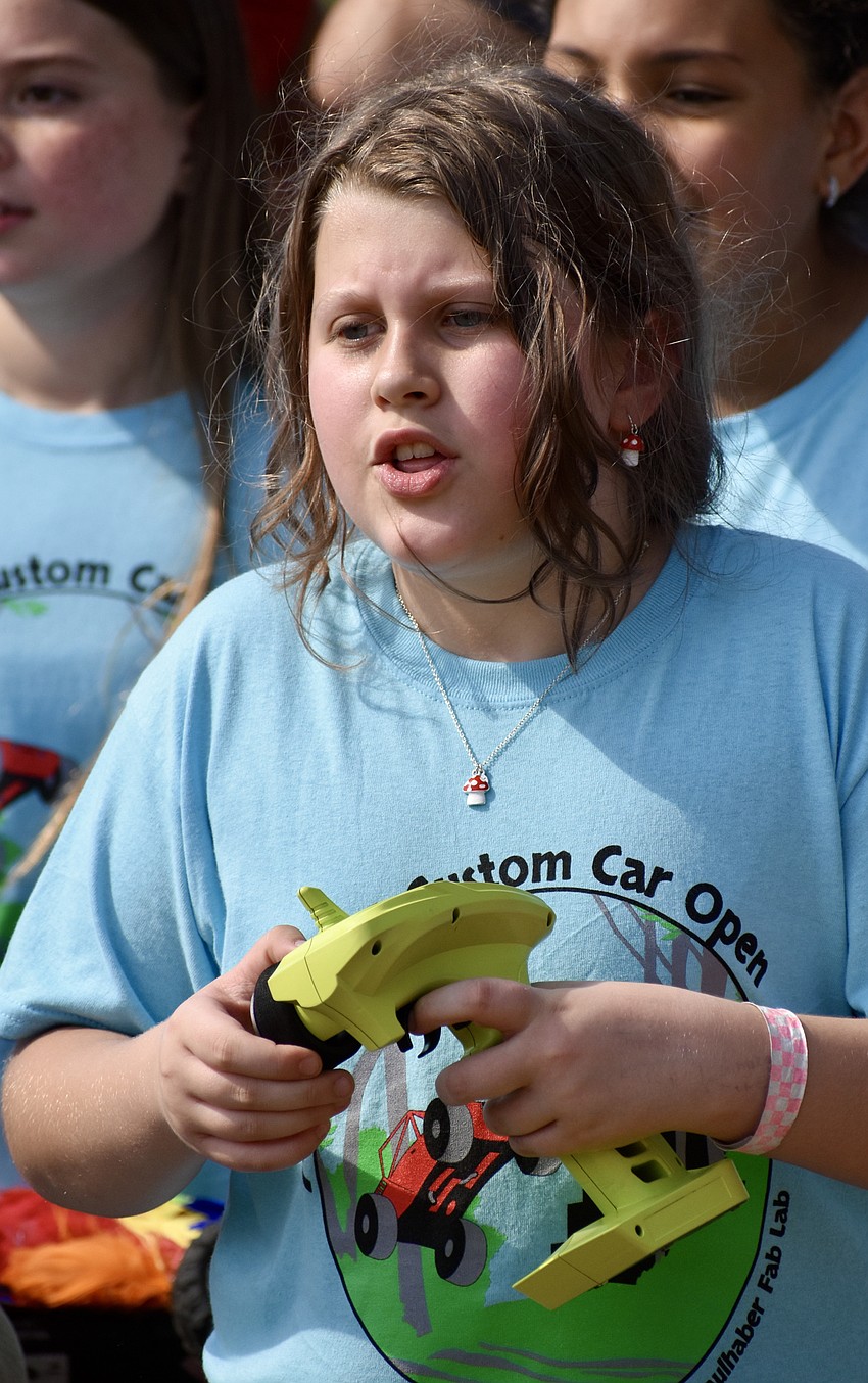 Tallulah Brand steers her car through the obstacle course.