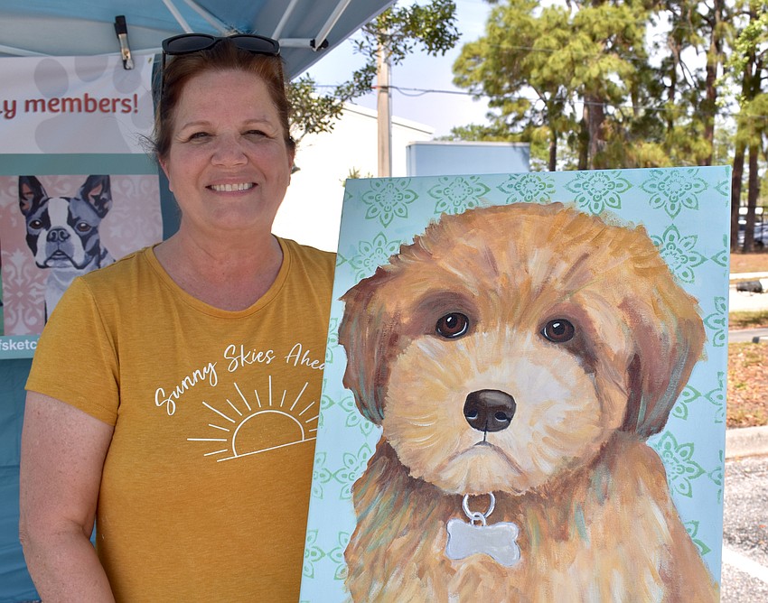 Jody Schneider, an art teacher at Fruitville Elementary, paints pet portraits as a business called Jody's Ruff Sketches.