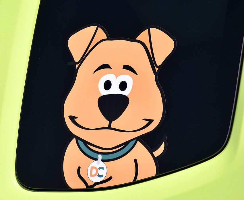 The mascot of Doodycalls.com on the side of a company truck.