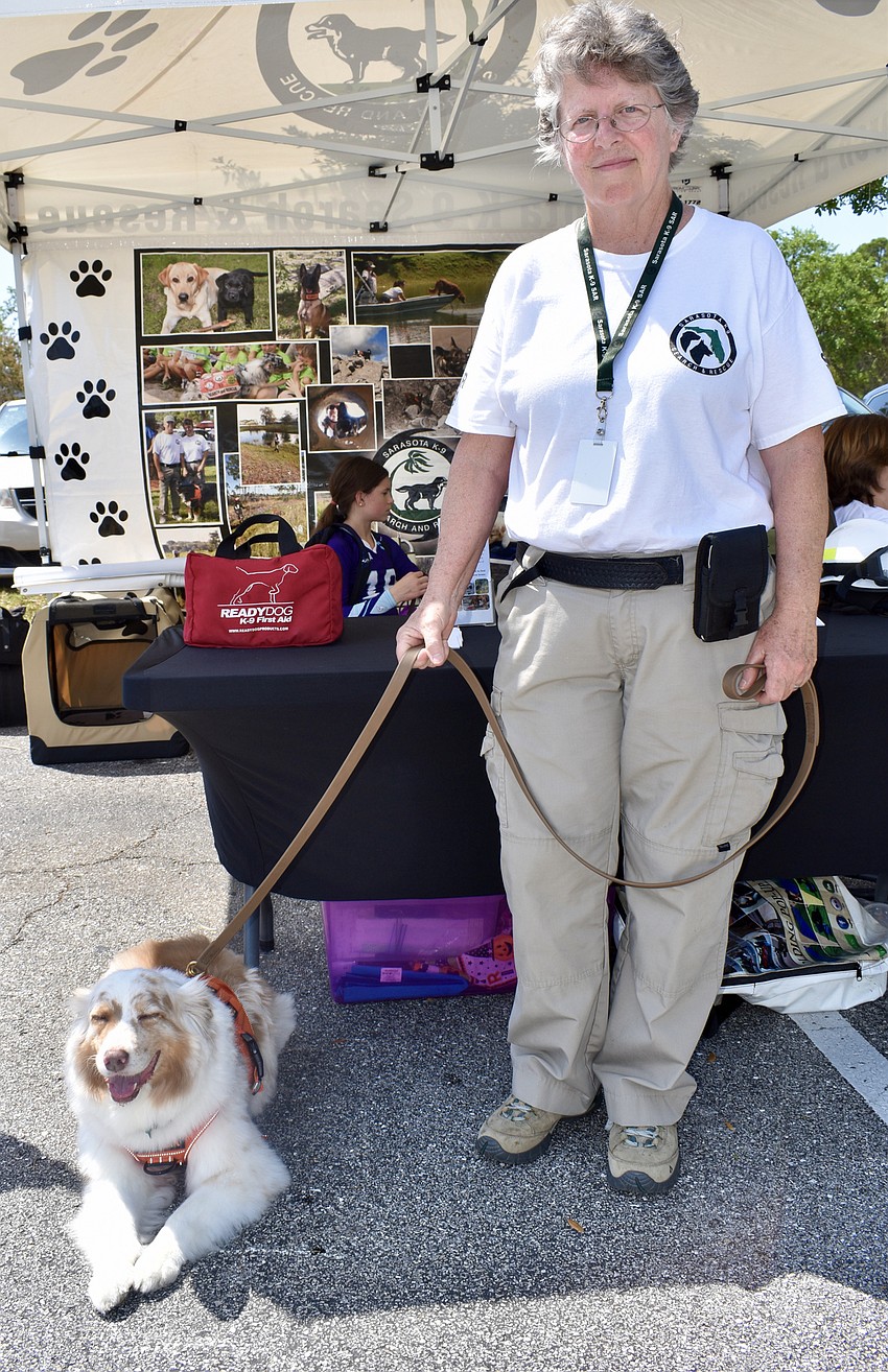 Maxine Miller of Sarasota K( Search and Rescue, with Piper, an Australian shepherd who recently retired.