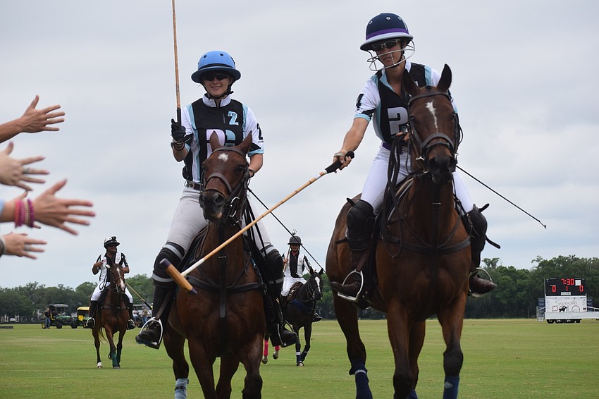 Laura Straussfeld and Lauren Proctor-Brown of the Ocala team greet the fans at the Sarasota Polo Club before Sunday's title game of the Women's Challenge.