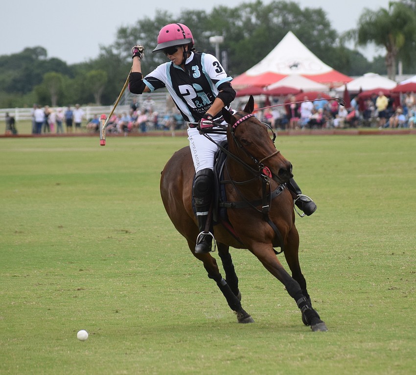 Ocala's  Alyson Poor gets ready to launch a back shot in the title game against Power Group Total Care.
