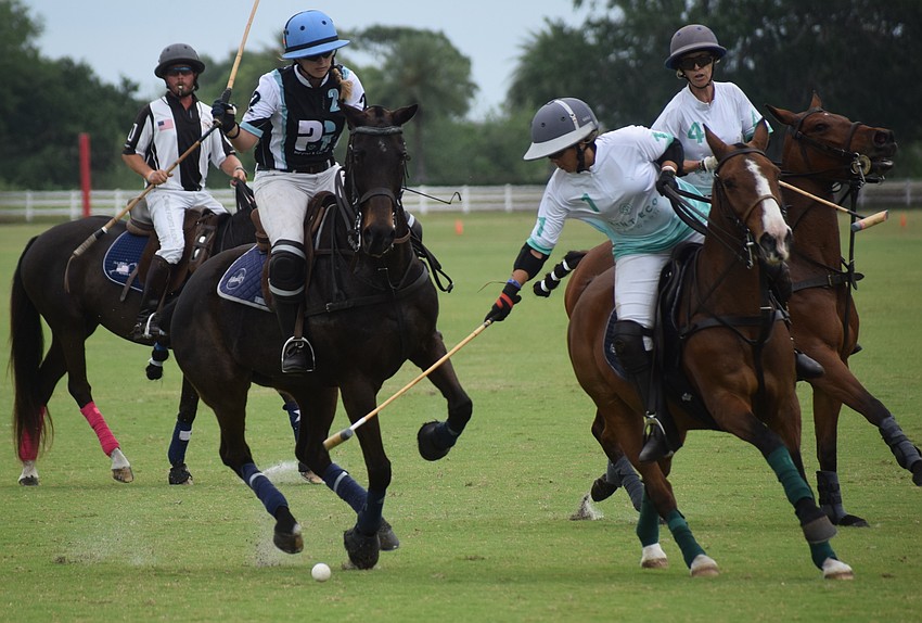 Power Group's Giuliana Tarazona (right) scoots the ball forward as Ocala's Laura Straussfeld charges forward.