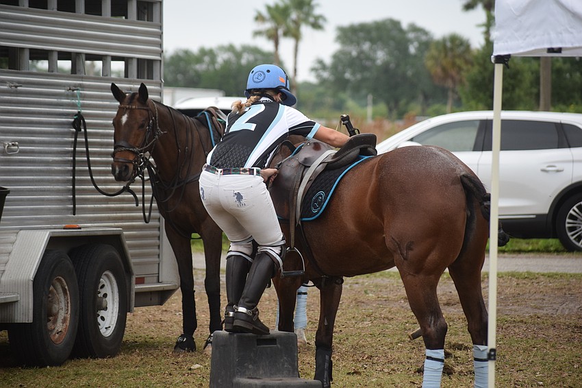 Ocala's Laura Straussfeld gets a boost up before the Women's Challenge title game.