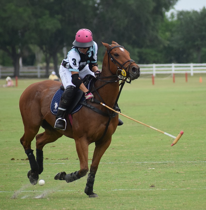 Ocala's Alyson Poor takes a swipe during the title game.