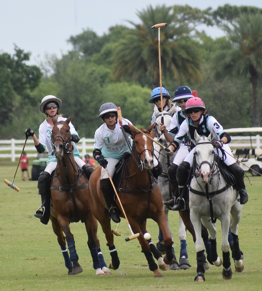 Power Group's Kyle Sheehan and Giuliana Tarazona and Ocala's Alyson Poor charge to the ball.