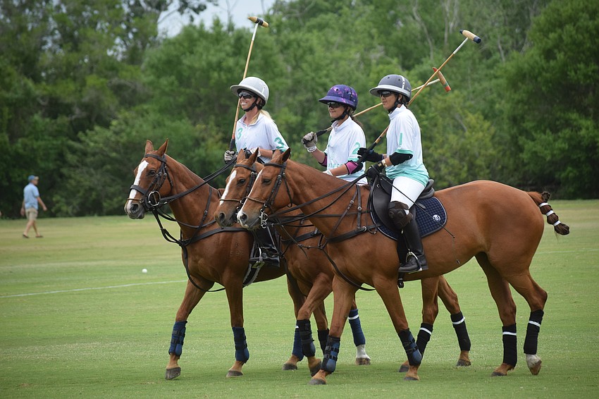 Power Group's Kyle Sheehan, Valentina Tarazona and Giuliana Tarazona visit with the fans before the Women's Challenge.