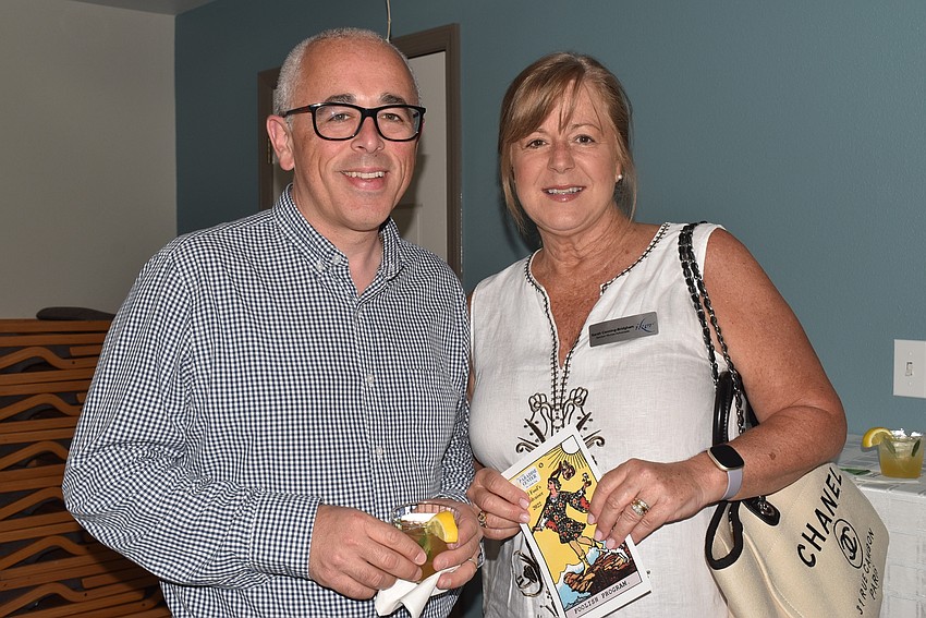 Rob Galkoff and Sarah Canning-Bridgham grabbed programs as they headed in.