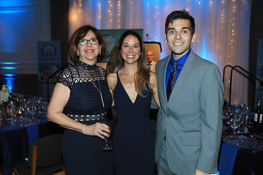 Lorri Laughlin with Tracy and Joel Valentino