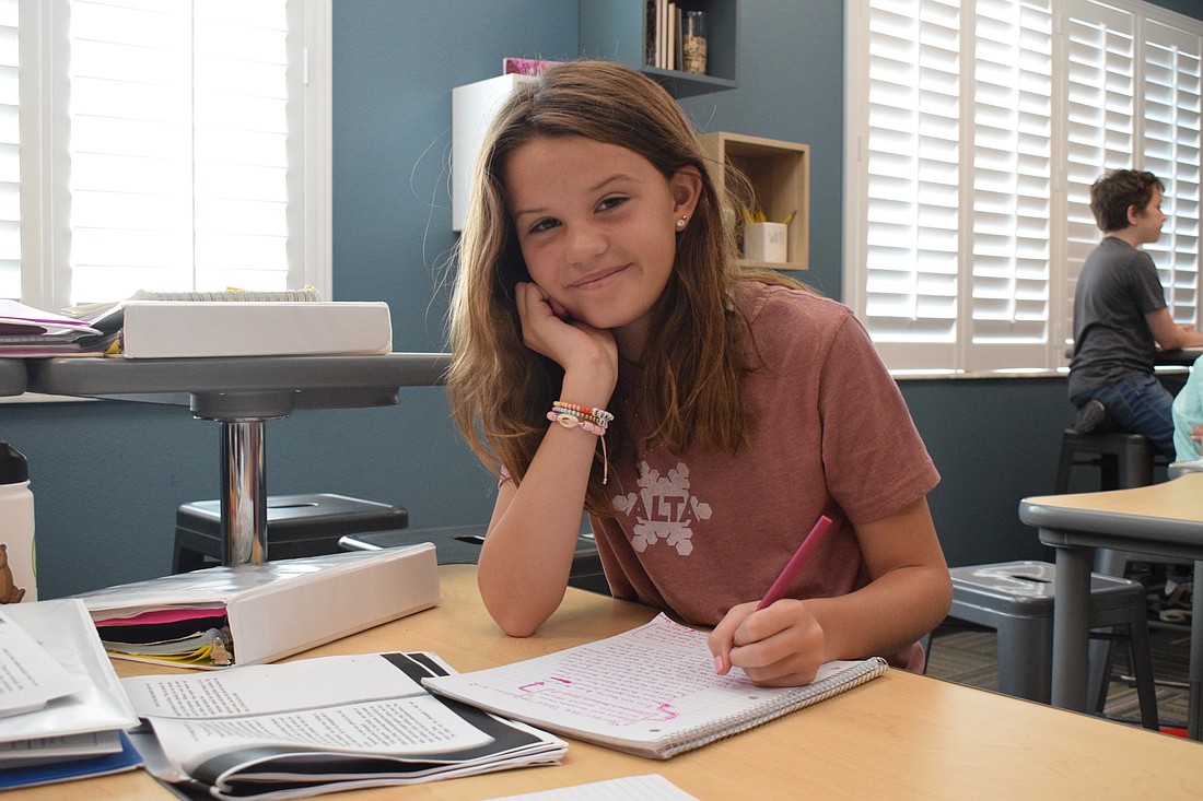 Elise Brownell, a middle school student, works on a lesson in class.