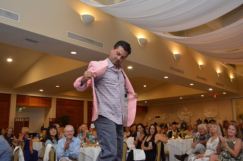 Aaron Virgin shows off the snazzy lining of his blazer.