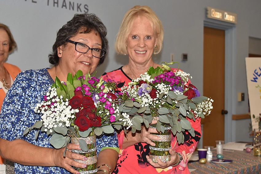 JoAnn Sifuentes and Susan DiNatale were presented with flowers for their service to the guild.