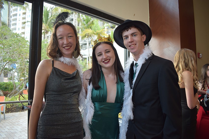 Seniors Antonia Boyd, Amber Parsons and Tobias Mazzone dress for the photo booth.