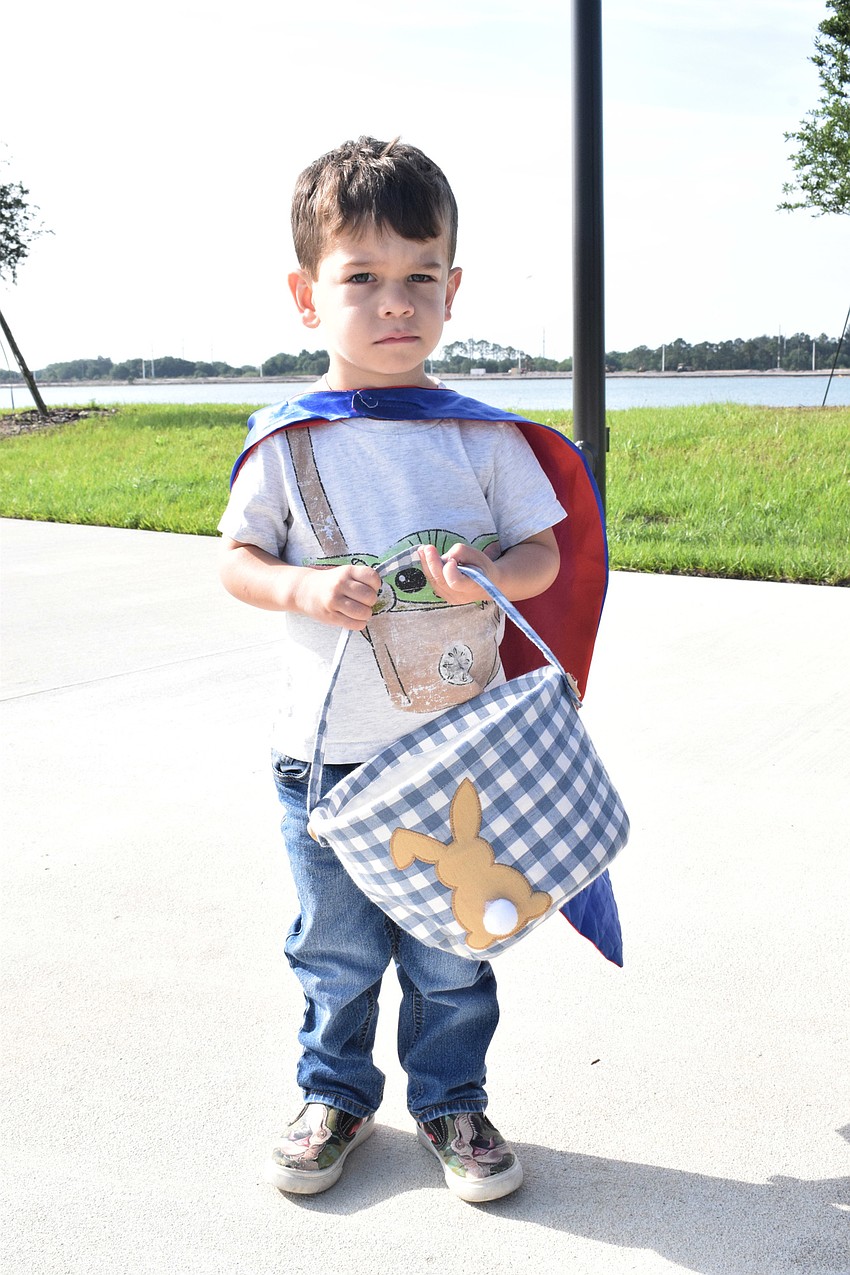 Lakewood Ranch's Dax Marrow, who is 3 years old, has his basket ready to collect eggs in the egg hunt.
