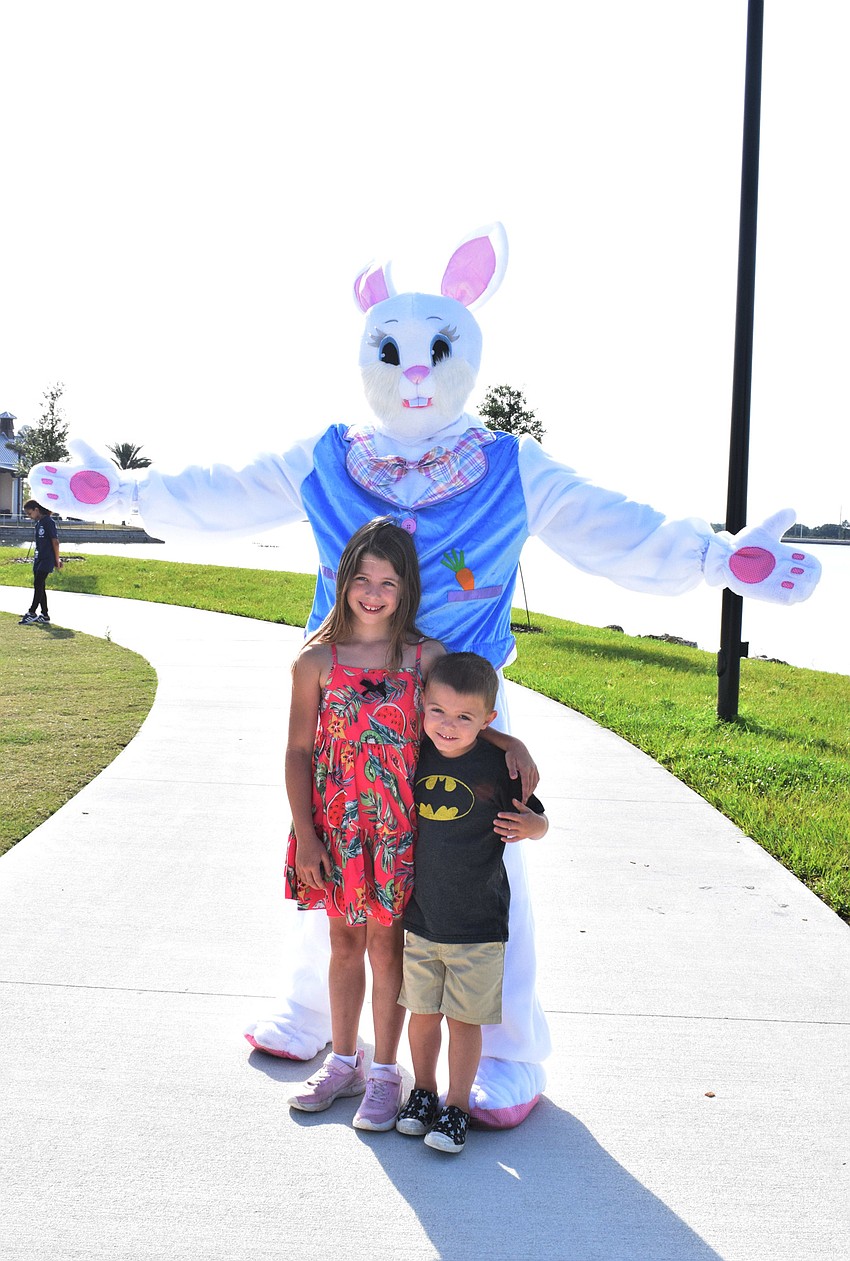 Lakewood Ranch's Ava Lynn Baker, who is 7, meets the Easter Bunny with her brother, Colton Baker, who is 4. Ava Lynn Baker says Easter is about sharing, giving and love.