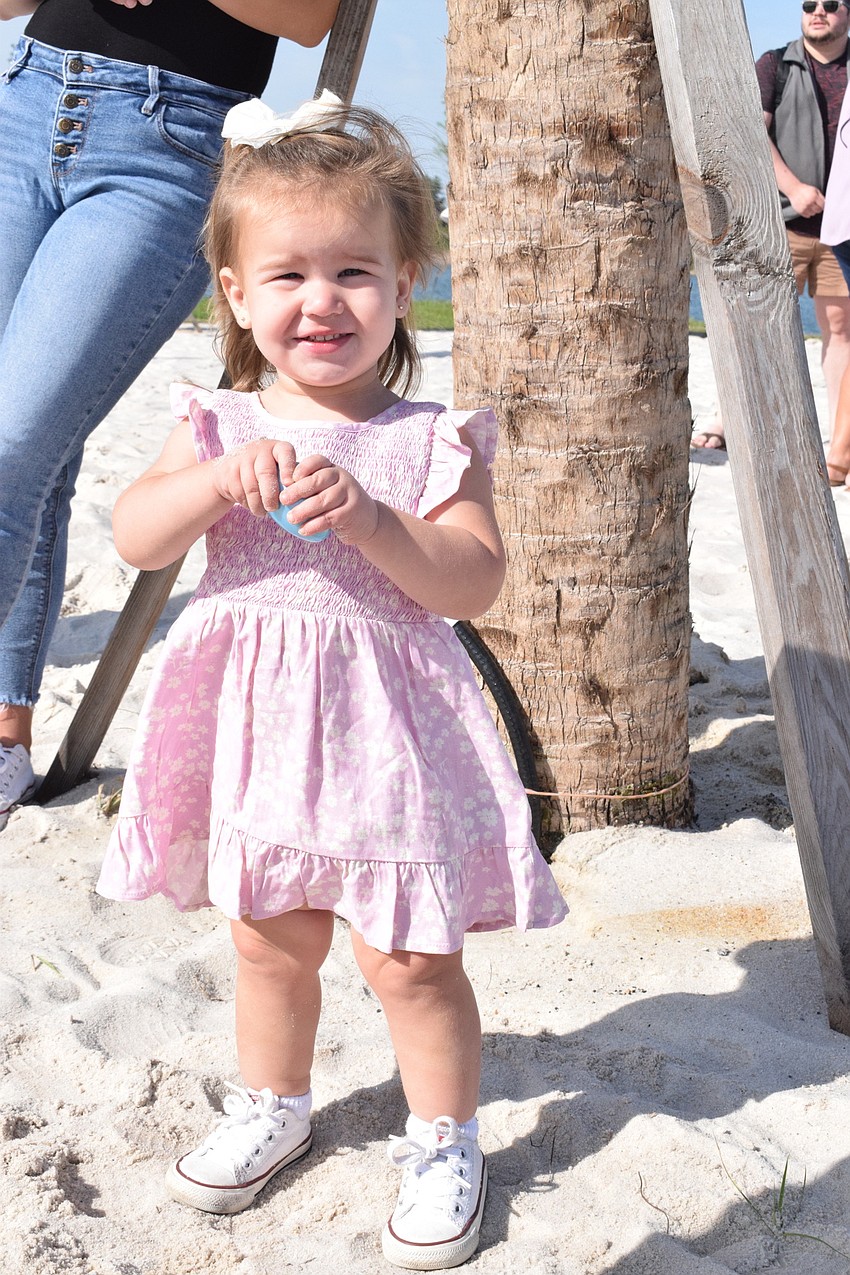 Parrish's Blakely Bridge, who is 1, plays with an egg.