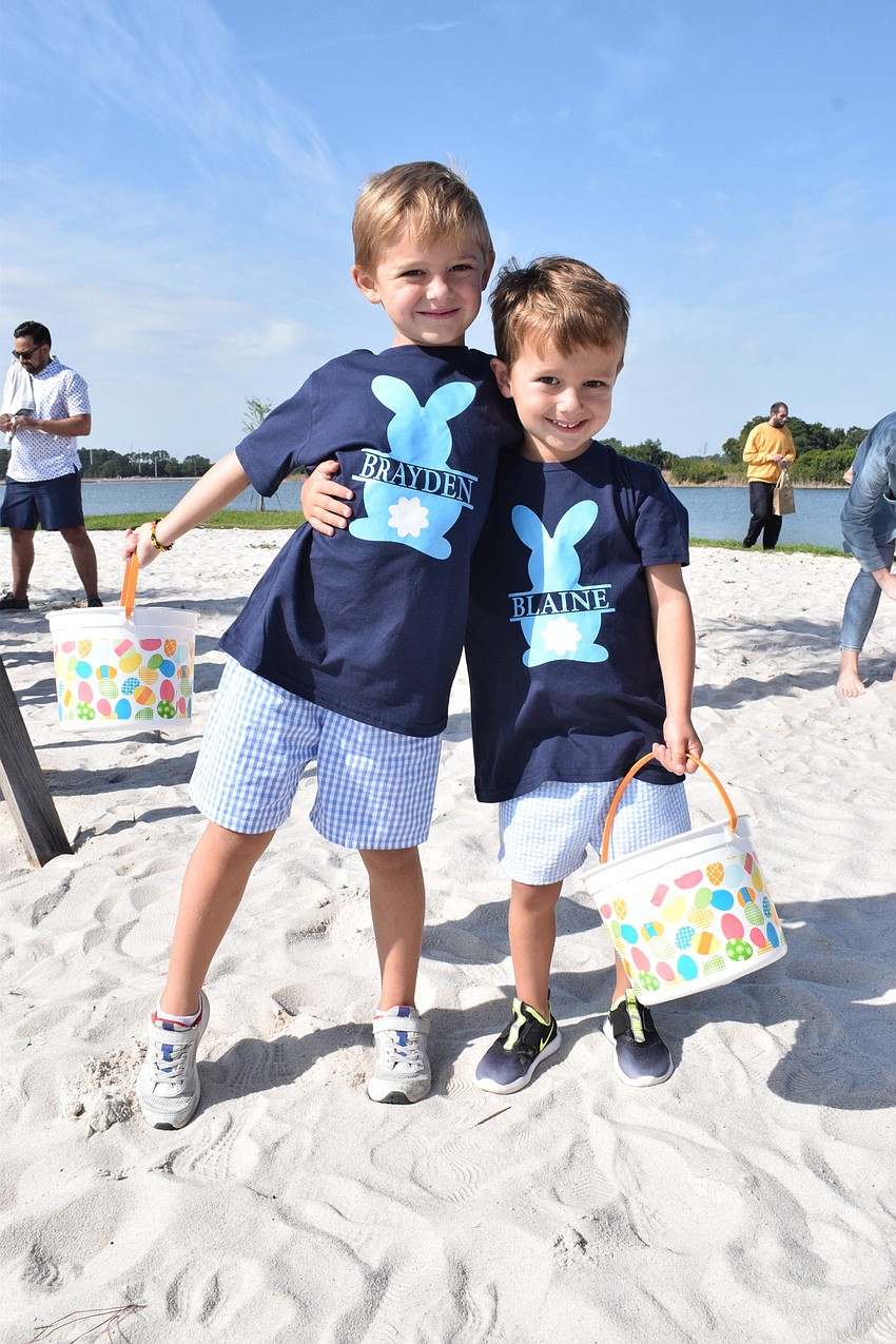 Panther Ridge's Brayden Williams, who is 6, and Blaine Williams, who is 4, wear matching shirts at EGGstravaganza. Brayden Williams was hopeful he would get a large brown bunny in the egg hunt.
