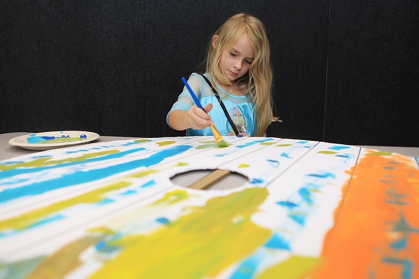 Amelia Hall works on her viking shield.