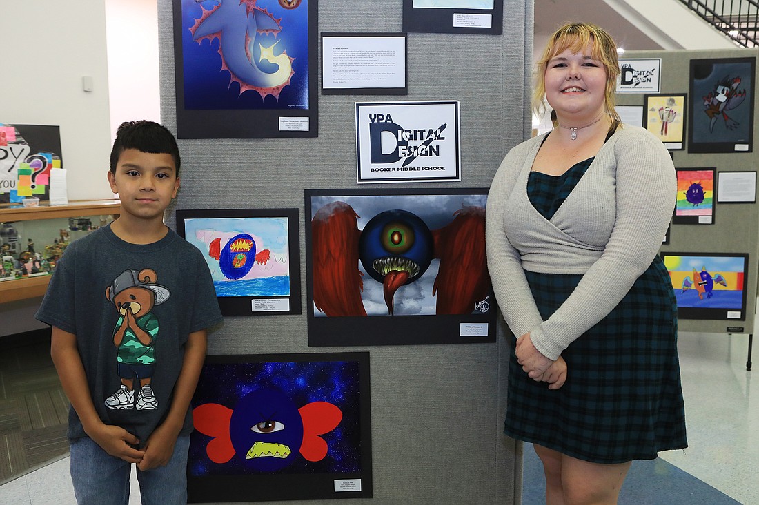 Tuttle Elementary student Ricardo Delasancha and Booker student Melissa Sheppard were happy to show their individual designs.