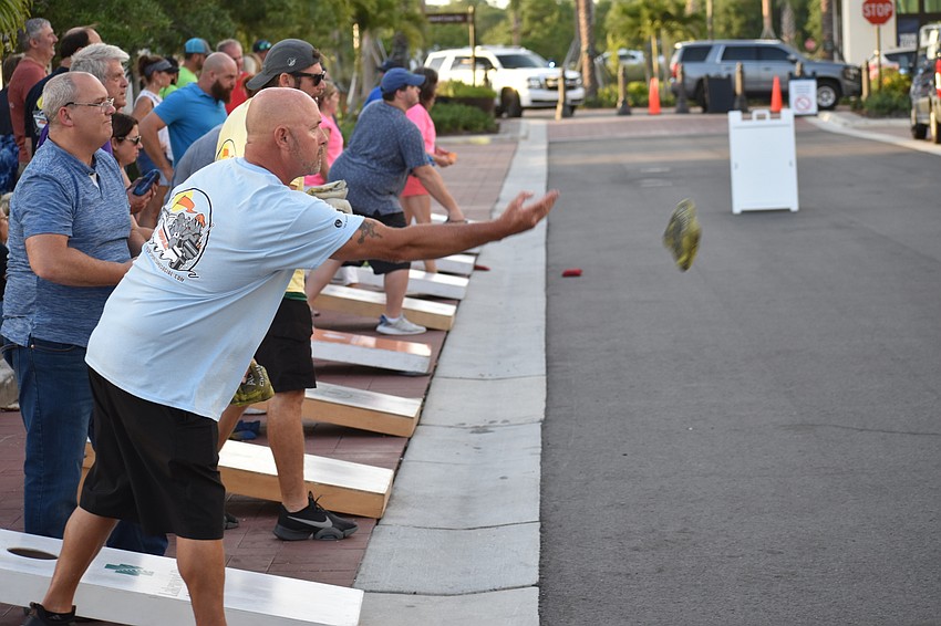 Bradenton's Dan Skidmore, who is a member of the MVP cornhole league, tosses the bag.