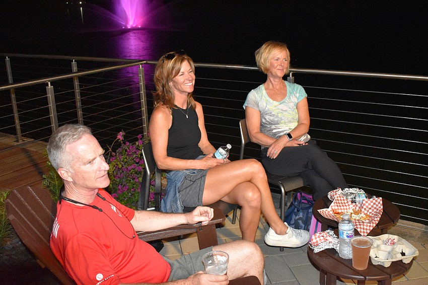 East County's Dan Love and Lakewood Ranch's Allyson Hoffman and Christie Boylston enjoy food with a fountain view.