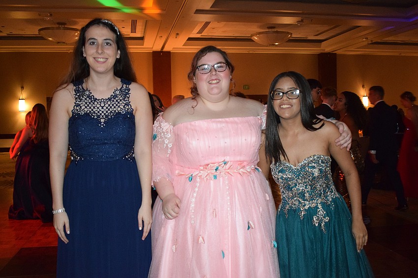 Senior Carmella Chieppo and juniors Laci McDonald and Giana Papa hit the dance floor.