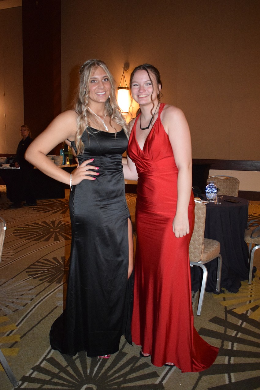 Seniors Taylor Evans and Lauralee Carter pause for a photo at the prom.