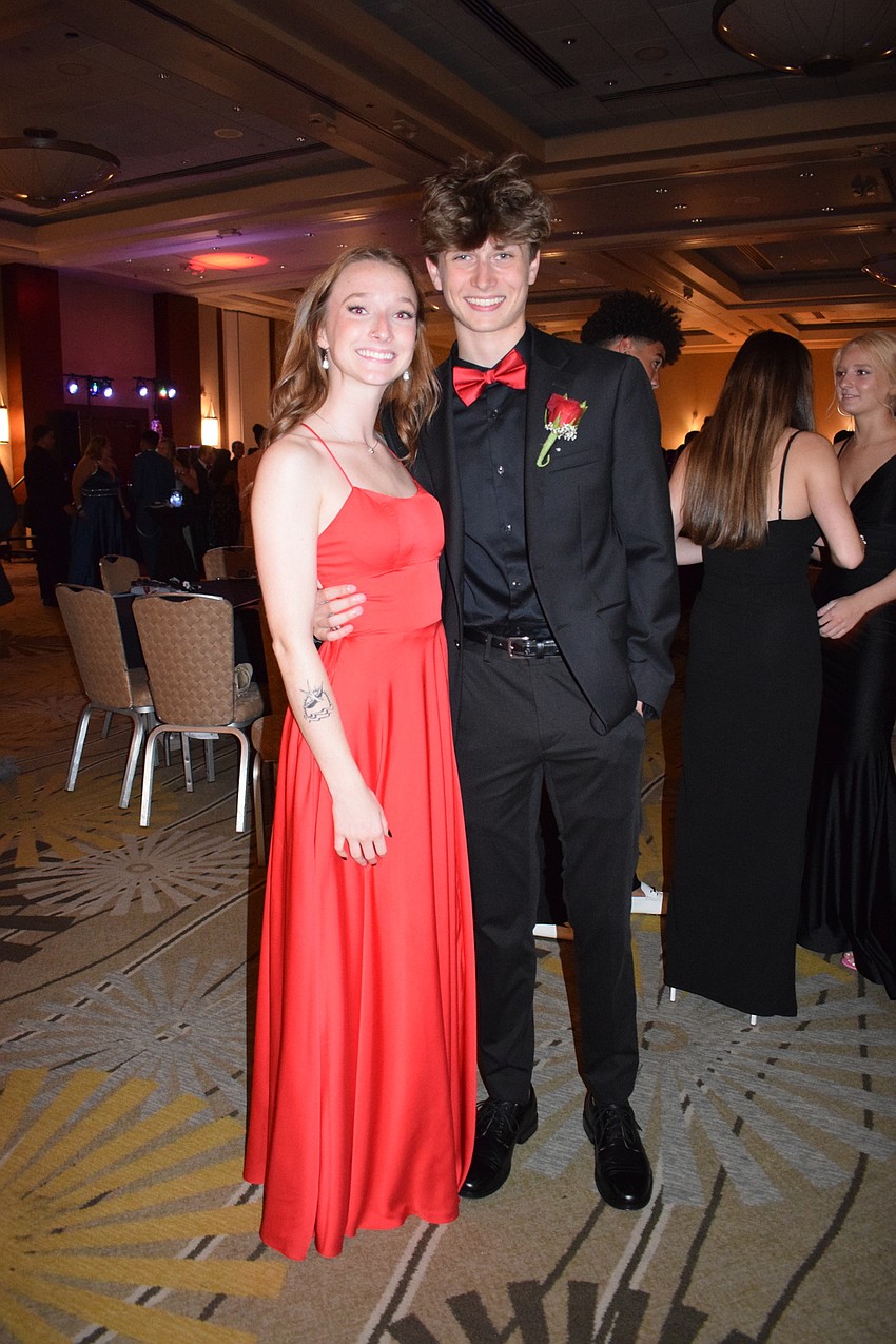 Senior Hannah King and junior Cameron Boyer take a break from the dance floor.